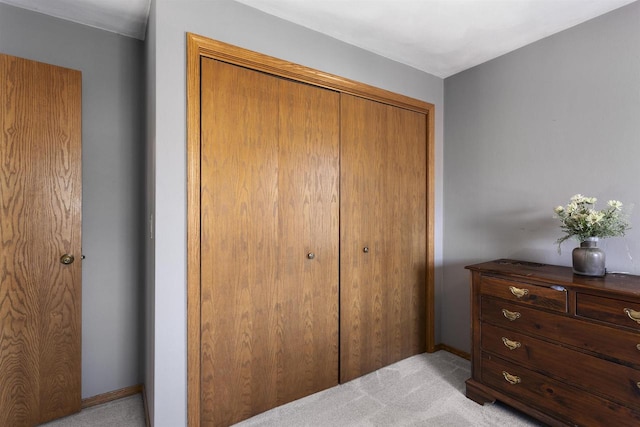 37 Pheasant Ct, Appleton, WI 54915 - bedroom with light carpet, a closet, and baseboards