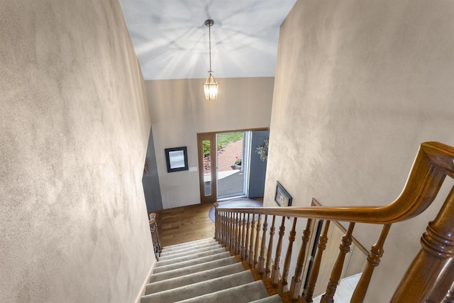 37 Pheasant Ct, Appleton, WI 54915 - staircase featuring wood finished floors and a towering ceiling