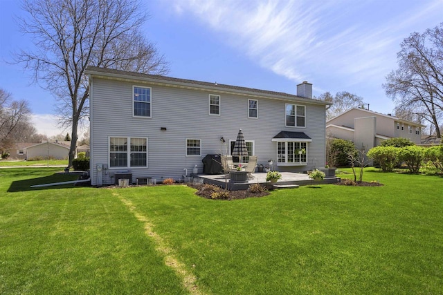 37 Pheasant Ct, Appleton, WI 54915 - back of property with a chimney, a yard, and a patio area