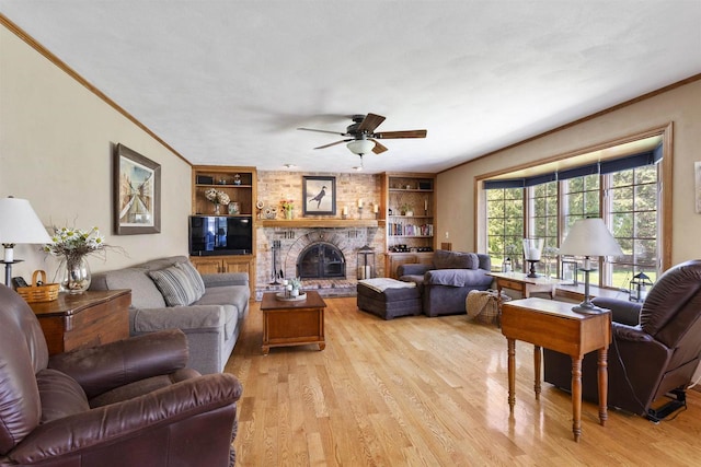 37 Pheasant Ct, Appleton, WI 54915 - living area with a ceiling fan, crown molding, built in features, light wood finished floors, and a fireplace