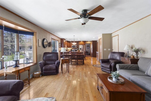 37 Pheasant Ct, Appleton, WI 54915 - living area featuring light wood finished floors, ceiling fan, and ornamental molding