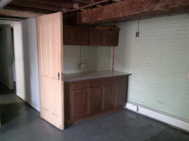 2309 Jefferson St, Two Rivers, WI 54241 - basement featuring brick wall