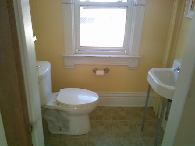 2309 Jefferson St, Two Rivers, WI 54241 - half bathroom with toilet and tile patterned floors