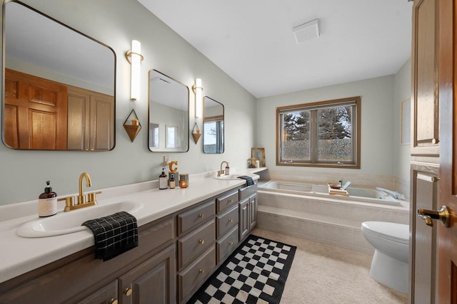 2108 Lawrence Dr, De Pere, WI 54115 - bathroom featuring a garden tub, double vanity, and toilet