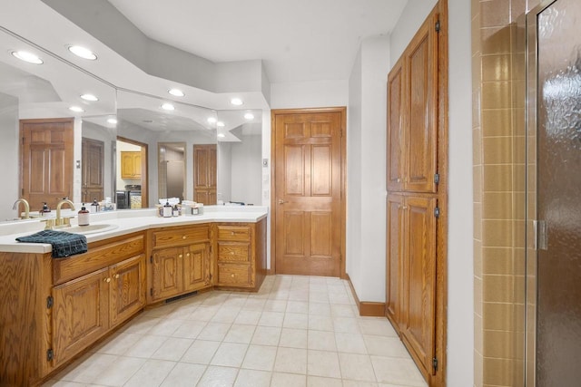 2108 Lawrence Dr, De Pere, WI 54115 - bathroom featuring recessed lighting, tile patterned floors, double vanity, an enclosed shower, and baseboards