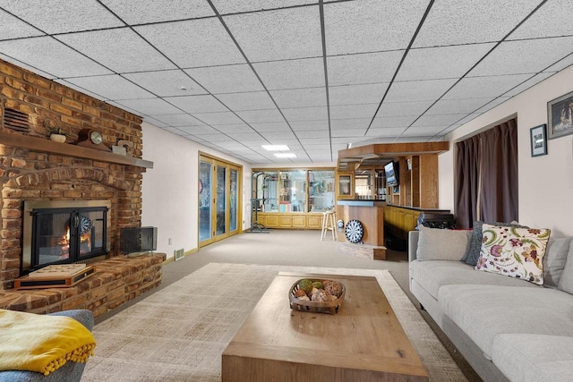 2108 Lawrence Dr, De Pere, WI 54115 - living room featuring carpet floors, a fireplace, a drop ceiling, and bar