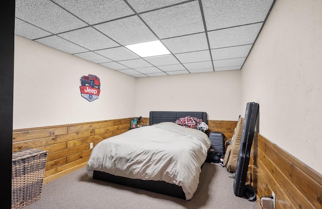 2108 Lawrence Dr, De Pere, WI 54115 - carpeted bedroom with wooden walls, wainscoting, and a paneled ceiling