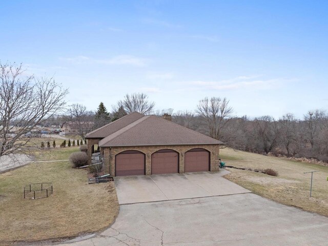 2108 Lawrence Dr, De Pere, WI 54115 - view of property exterior with a yard, driveway, roof with shingles, and brick siding
