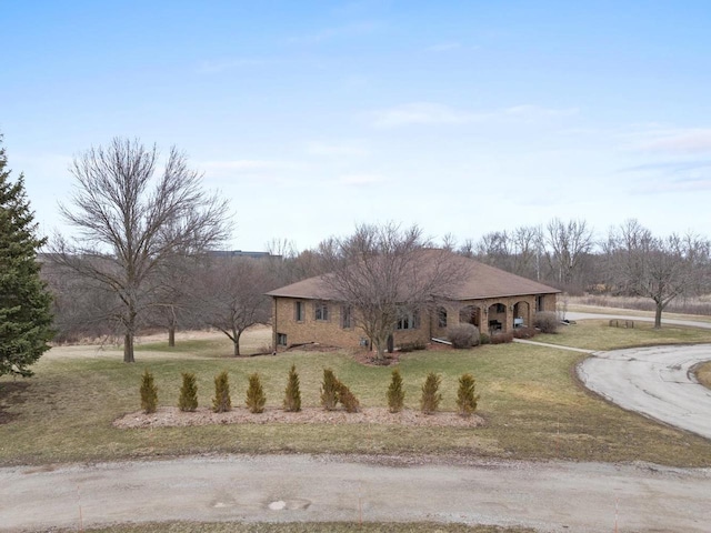 2108 Lawrence Dr, De Pere, WI 54115 - ranch-style house featuring driveway and a front lawn
