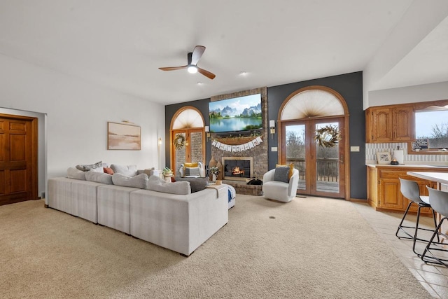 2108 Lawrence Dr, De Pere, WI 54115 - living room with ceiling fan, light carpet, a fireplace, and healthy amount of natural light