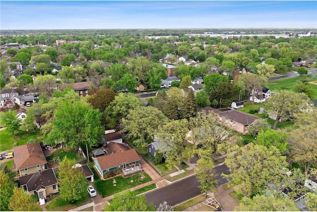 aerial view of property and surrounding area with nearby suburban area