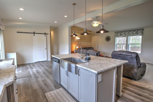 W5977 Lakeview Dr, Montello, WI 53949 - kitchen featuring a sink, a barn door, open floor plan, light wood finished floors, and recessed lighting