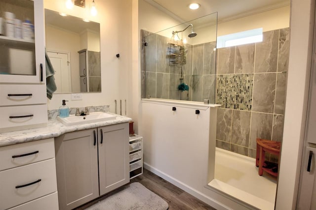 W5977 Lakeview Dr, Montello, WI 53949 - full bathroom featuring crown molding, walk in shower, wood finished floors, vanity, and baseboards