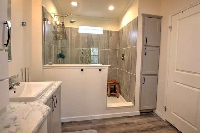 W5977 Lakeview Dr, Montello, WI 53949 - bathroom with walk in shower, vanity, wood finished floors, ornamental molding, and recessed lighting