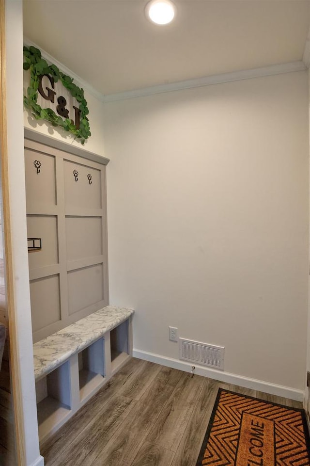 W5977 Lakeview Dr, Montello, WI 53949 - mudroom with ornamental molding, wood finished floors, and baseboards