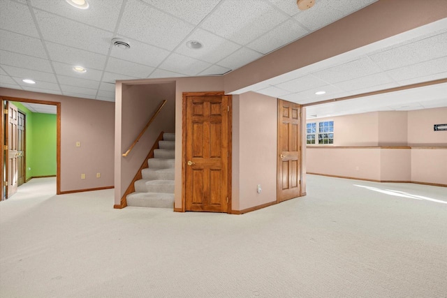 N109W14760 Preserve Pkwy, Germantown, WI 53022 - basement with baseboards, carpet floors, a drop ceiling, stairs, and recessed lighting