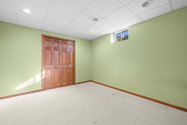 N109W14760 Preserve Pkwy, Germantown, WI 53022 - unfurnished bedroom with carpet floors, a closet, baseboards, and a paneled ceiling