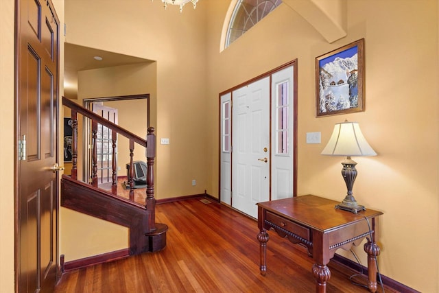 N109W14760 Preserve Pkwy, Germantown, WI 53022 - foyer entrance featuring baseboards, wood finished floors, stairs, and a towering ceiling