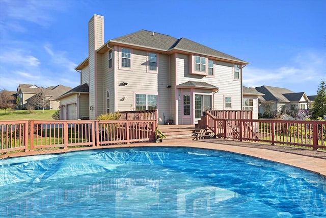 N109W14760 Preserve Pkwy, Germantown, WI 53022 - view of swimming pool with a wooden deck and a residential view