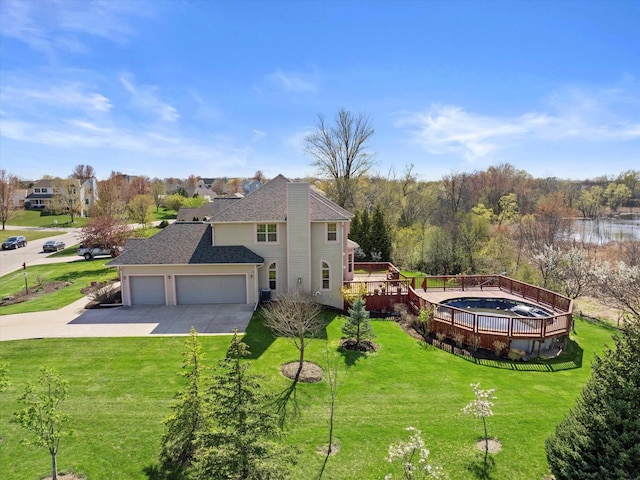 N109W14760 Preserve Pkwy, Germantown, WI 53022 - view of property exterior featuring an attached garage, a lawn, concrete driveway, and a deck