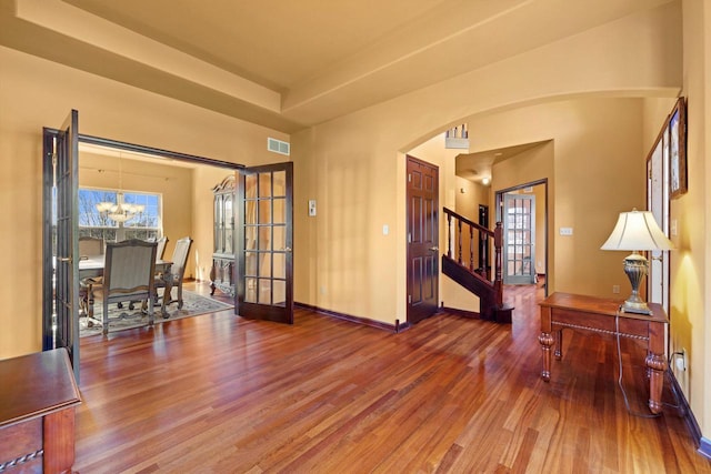 N109W14760 Preserve Pkwy, Germantown, WI 53022 - foyer with arched walkways, wood finished floors, a chandelier, baseboards, and stairway