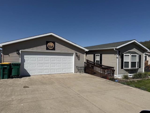 33150 Donna Dr Unit 14, Prairie Du Chien, WI 53821 - single story home featuring a garage, an outdoor structure, and concrete driveway