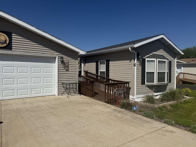 33150 Donna Dr Unit 14, Prairie Du Chien, WI 53821 - view of side of property with driveway and a garage