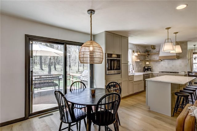 E1924 Kirk Ct, Eau Claire, WI 54701 - dining space featuring healthy amount of natural light and light wood-style flooring