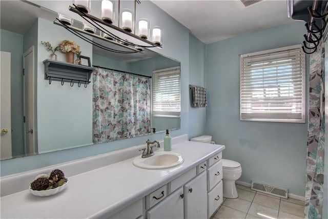 303 W Maple St, Thorp, WI 54771 - full bathroom featuring plenty of natural light, tile patterned flooring, toilet, and vanity