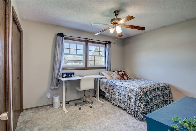 303 W Maple St, Thorp, WI 54771 - bedroom featuring a textured ceiling, carpet, and ceiling fan