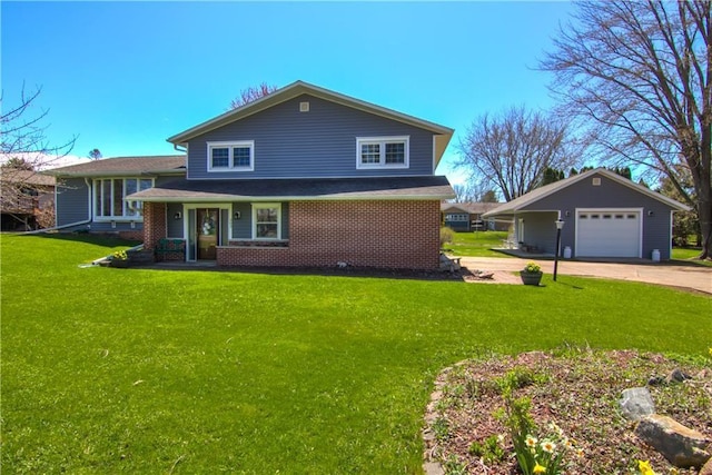 303 W Maple St, Thorp, WI 54771 - tri-level home with a garage, a front yard, driveway, and brick siding