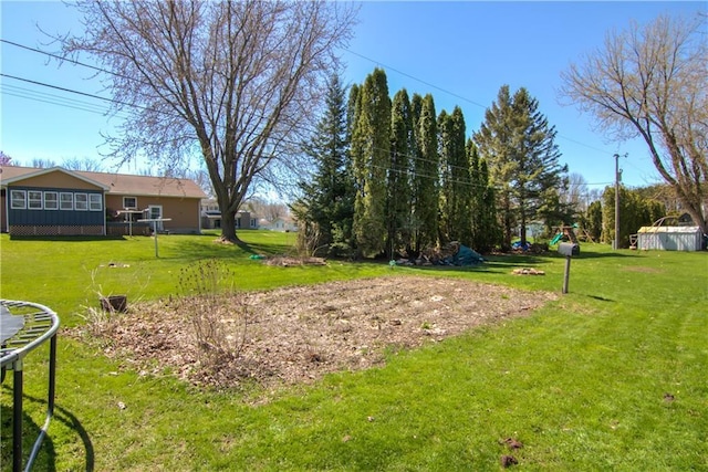 303 W Maple St, Thorp, WI 54771 - view of community with a yard