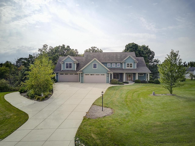 3271 Bay Hill Rd, Port Washington, WI 53074 - view of front of property with concrete driveway, a front lawn, a porch, and an attached garage