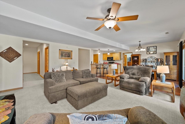 3271 Bay Hill Rd, Port Washington, WI 53074 - living room featuring a chandelier, light colored carpet, a ceiling fan, baseboards, and recessed lighting