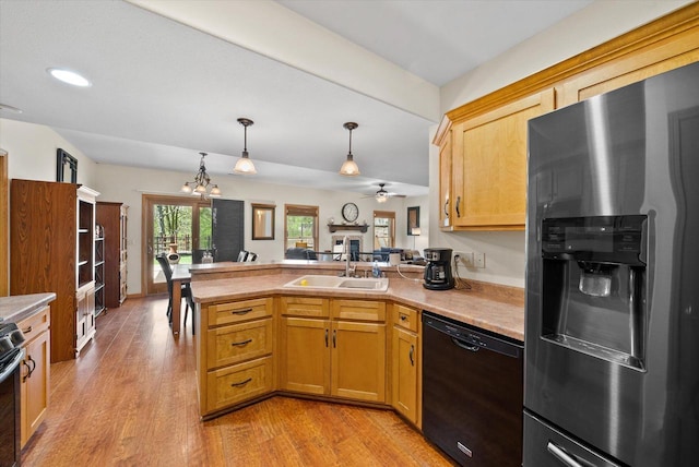 3271 Bay Hill Rd, Port Washington, WI 53074 - kitchen with stainless steel fridge, dishwasher, a sink, a peninsula, and light wood finished floors