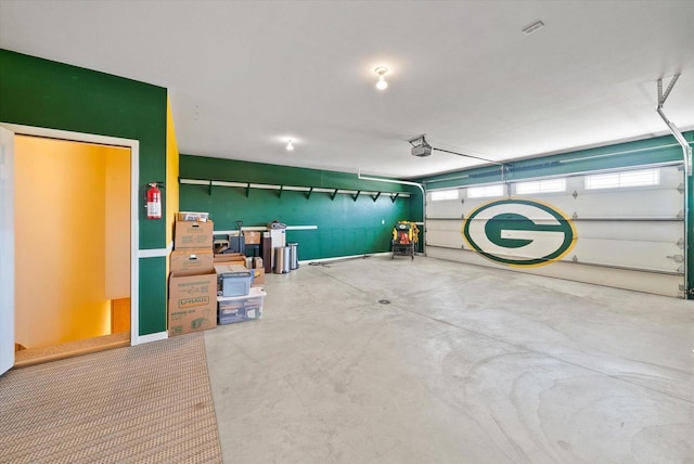 3271 Bay Hill Rd, Port Washington, WI 53074 - garage featuring a garage door opener