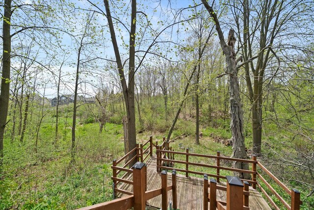 3271 Bay Hill Rd, Port Washington, WI 53074 - wooden deck featuring a view of trees