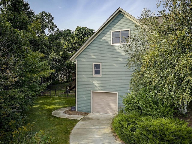 3271 Bay Hill Rd, Port Washington, WI 53074 - view of side of home with driveway and an attached garage
