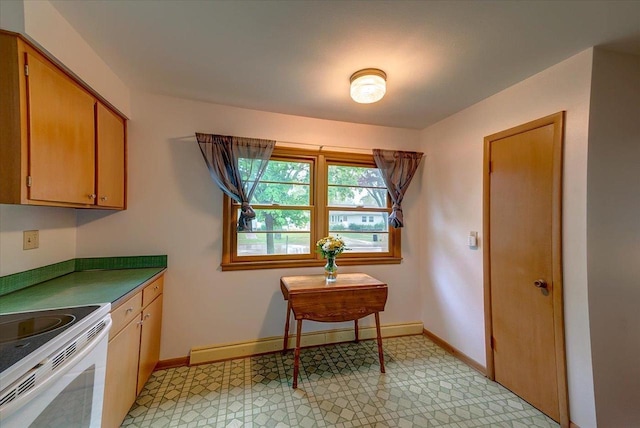 49 Schenk St, Madison, WI 53714 - kitchen with white electric range, baseboards, a baseboard heating unit, and light flooring