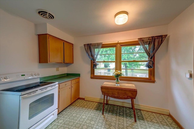 49 Schenk St, Madison, WI 53714 - kitchen featuring white range with electric stovetop, baseboards, a baseboard heating unit, and light floors