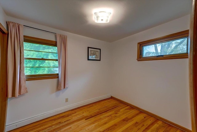 49 Schenk St, Madison, WI 53714 - spare room featuring a baseboard radiator, light wood-type flooring, and baseboards