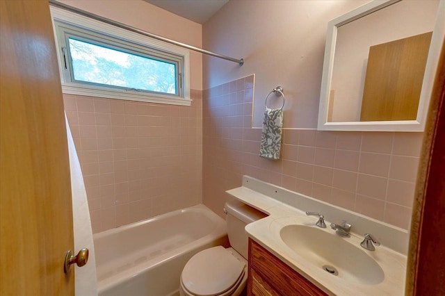 49 Schenk St, Madison, WI 53714 - bathroom featuring tile walls, toilet, shower / tub combination, and vanity