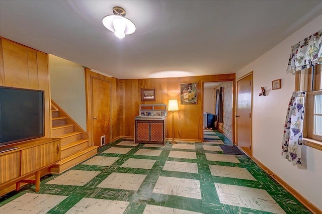 49 Schenk St, Madison, WI 53714 - interior space with stairway, tile patterned floors, wood walls, and baseboards