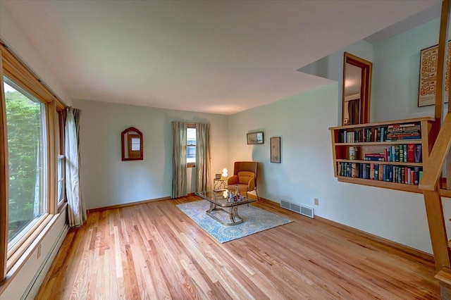 49 Schenk St, Madison, WI 53714 - living area with plenty of natural light, wood finished floors, and baseboards