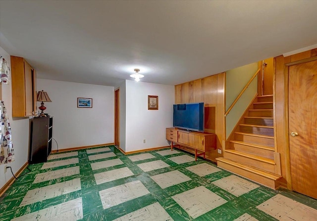 49 Schenk St, Madison, WI 53714 - finished below grade area featuring stairway, light flooring, and baseboards