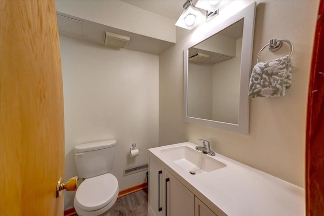 49 Schenk St, Madison, WI 53714 - half bath with toilet, vanity, and wood finished floors