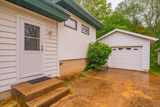 49 Schenk St, Madison, WI 53714 - view of property exterior featuring an outbuilding, a garage, and driveway