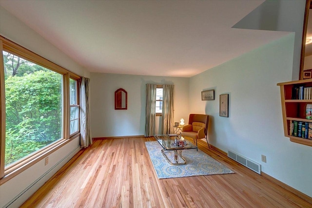 49 Schenk St, Madison, WI 53714 - living area with light wood-style flooring and baseboards
