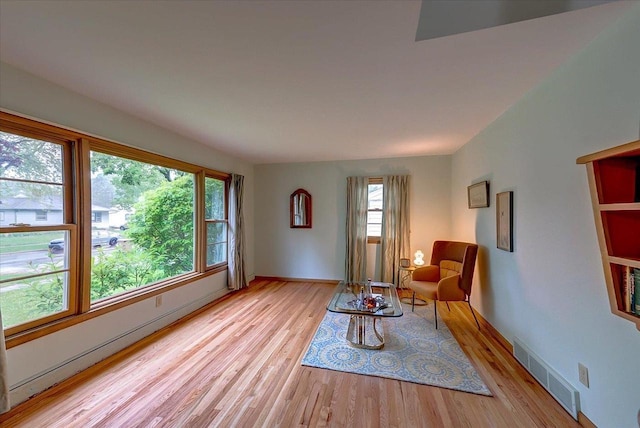 49 Schenk St, Madison, WI 53714 - sitting room with light wood-style flooring and baseboards