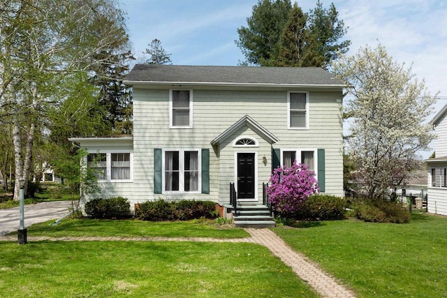 395 Lake St, Green Lake, WI 54941 - colonial house with a front lawn